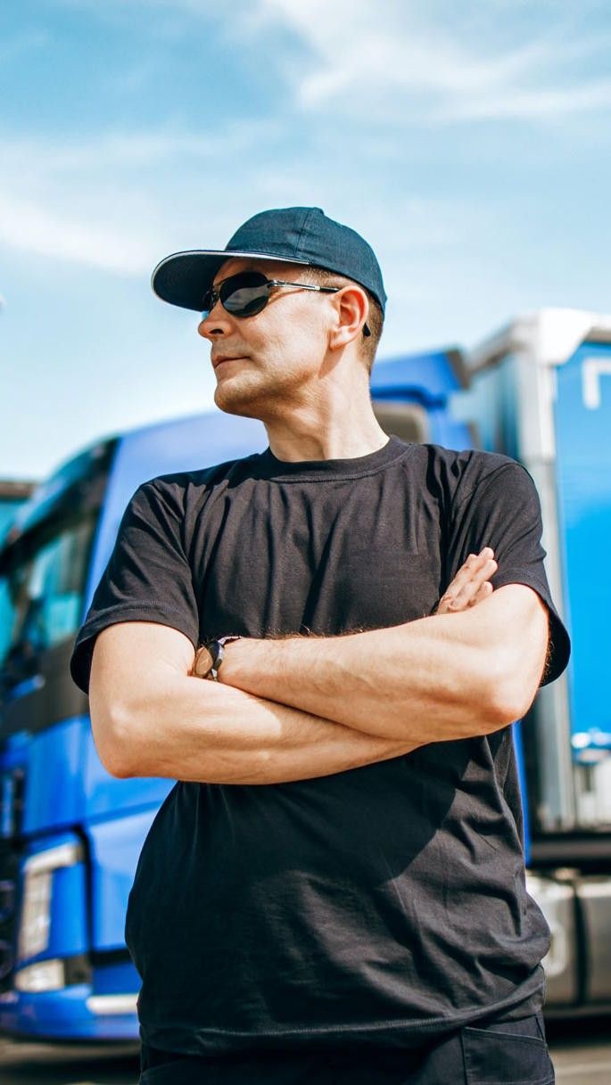 Man in front of vans